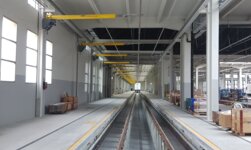 Overhead travelling crane with anti-collision system and crane track monitoring