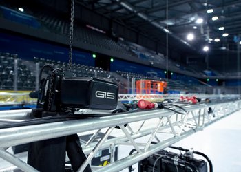 Electric chain hoists lift trusses in ice hockey stadium