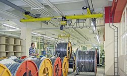 Transport of cable reels with travelling crane