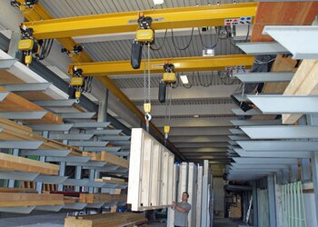 Underslung travelling cranes with GIS electric chain hoists Transporting window frames with GIS overhead travelling cranes