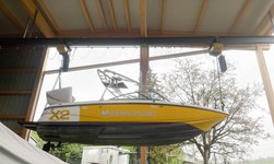 Two electric chain hoists on overhead travelling crane lift boat