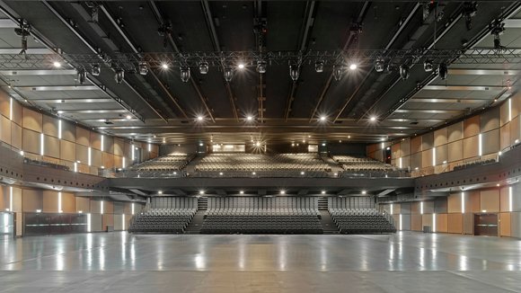 The concert hall with the basic framework of the rigging system with electric chain hoists and motor trolleys