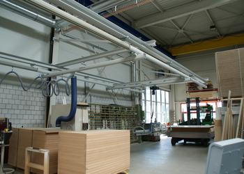Crane system with vacuum lifters for door production The GIS handling system consists of a light crane system with electric chain hoist, vacuum lifting device and tube lifter