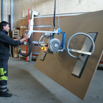 Vacuum handling system lifts wooden panel A large wooden panel is lifted by the forklift, tilted by 90° and moved to the vertical saw for cutting to size