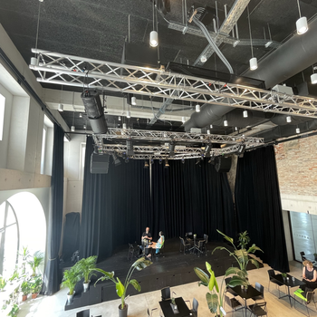 Stage with lounge area Chain motors for holding stage equipment above people