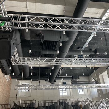 Stage system with GIS motors GIS motors hold a truss with loudspeaker