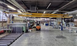 Underslung travelling crane with telescopic arm Indoor crane with extendable crane bridge for larger working area